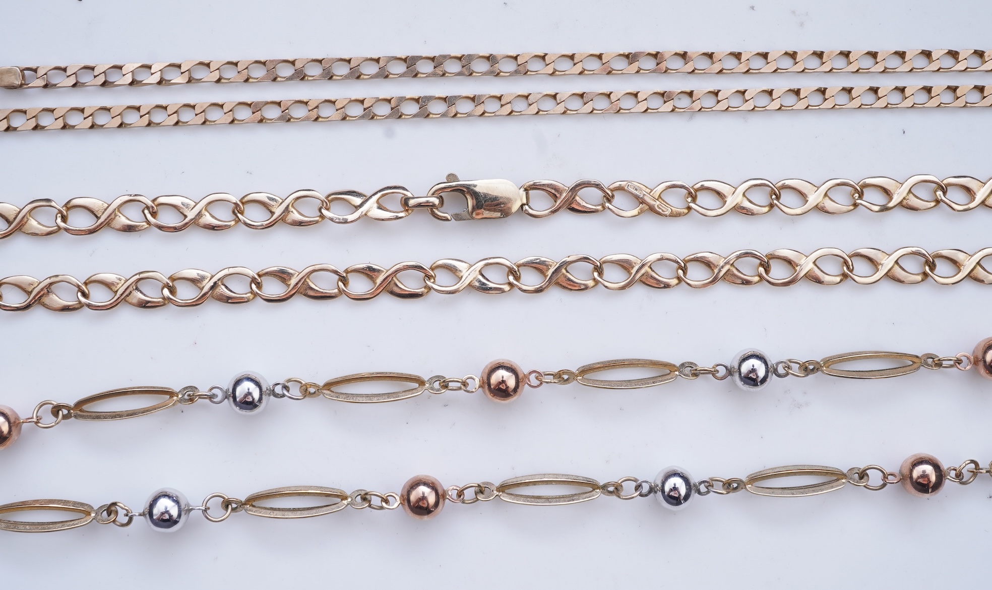 Three gold necklaces